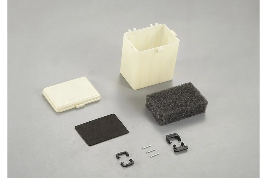 Killerbody plastic tote box kit including a container, lid, foam inserts, and small black plastic clips on a grey background.