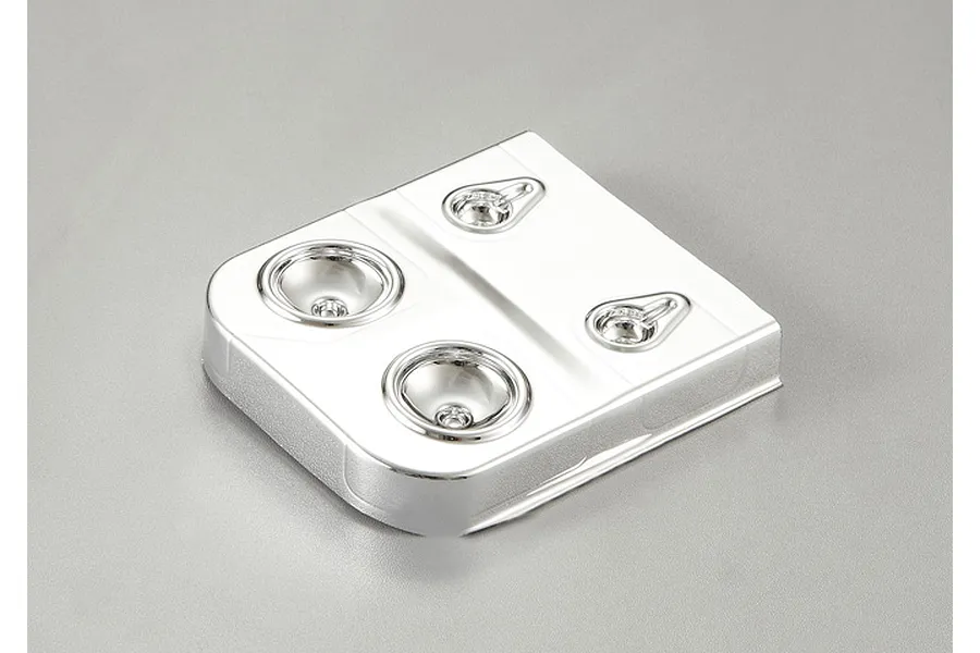 A chrome-finished plastic light bucket assembly for a 1/10 scale RC crawler, featuring two large and two small circular light housing recesses.