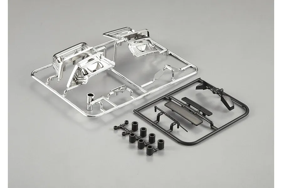 Killerbody 1/10 Alfa Romeo 75 Turbo Evoluzione plastic parts set including chrome-plated and black molded components on sprues.