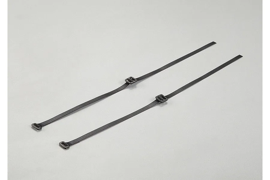 Two black fabric cable ties with plastic buckles laid out on a plain light grey background.