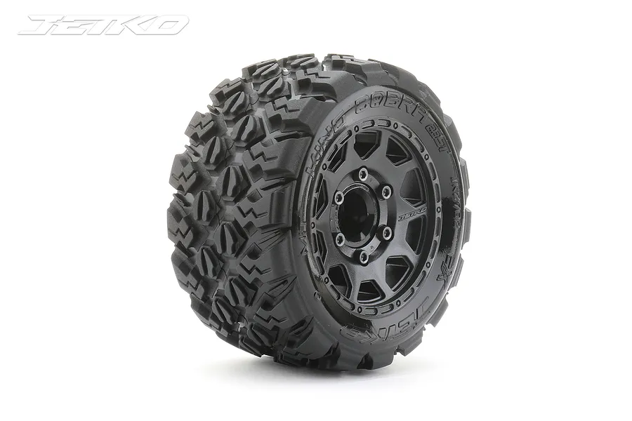 A single Jetko 1/10 scale Ex-King Cobra tyre mounted on a black Claw rim, featuring an aggressive tread pattern and a 12mm hex mount.