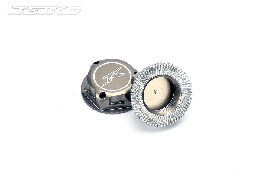 Two gunmetal grey aluminium 17mm flanged serrated wheel nuts for RC cars, featuring the Jetko logo on the face.