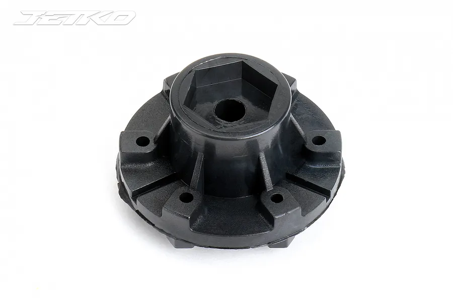 A black plastic 1/10 scale RC wheel connector with a 12mm hex mount, viewed from an angle against a white background.