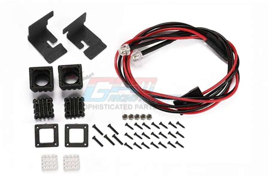 GPM Racing black spotlight kit including two LED lights, mounting brackets, housings, and various screws on a white background.