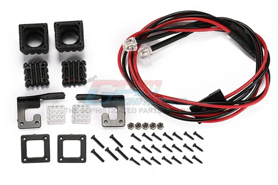 GPM Racing black spotlight kit including two LED lights, mounting brackets, screws, and housing components on a white background.