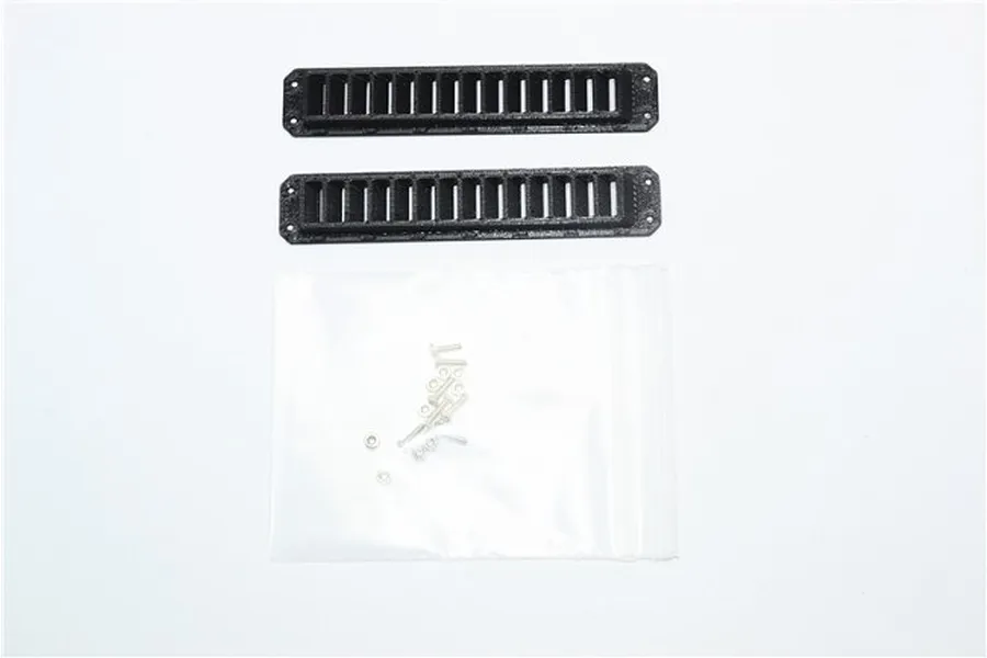 Two black rectangular RC ventilation port covers with a small plastic bag containing mounting screws and nuts on a white background.