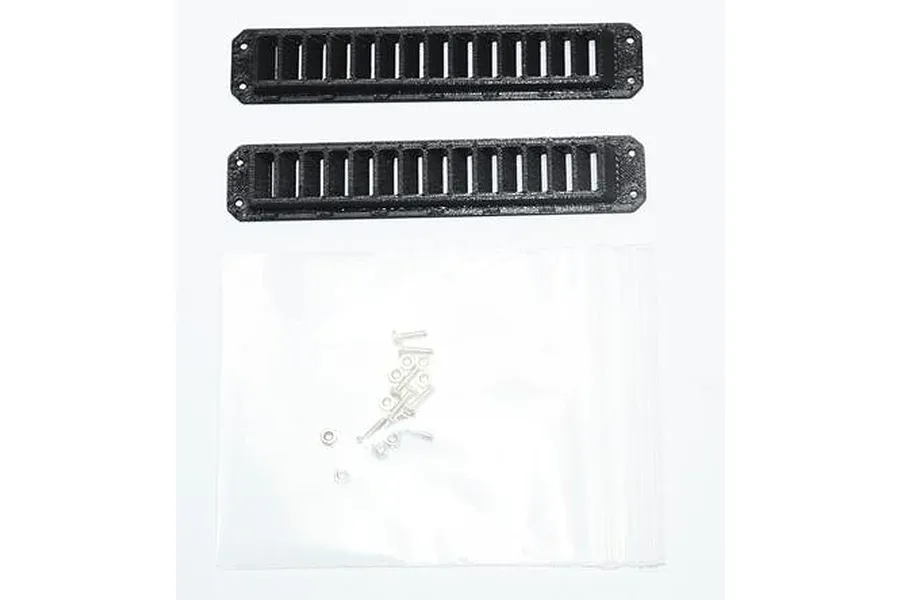 GPM Racing black rear side ventilation ports for RC vehicles with included mounting hardware in a plastic bag.