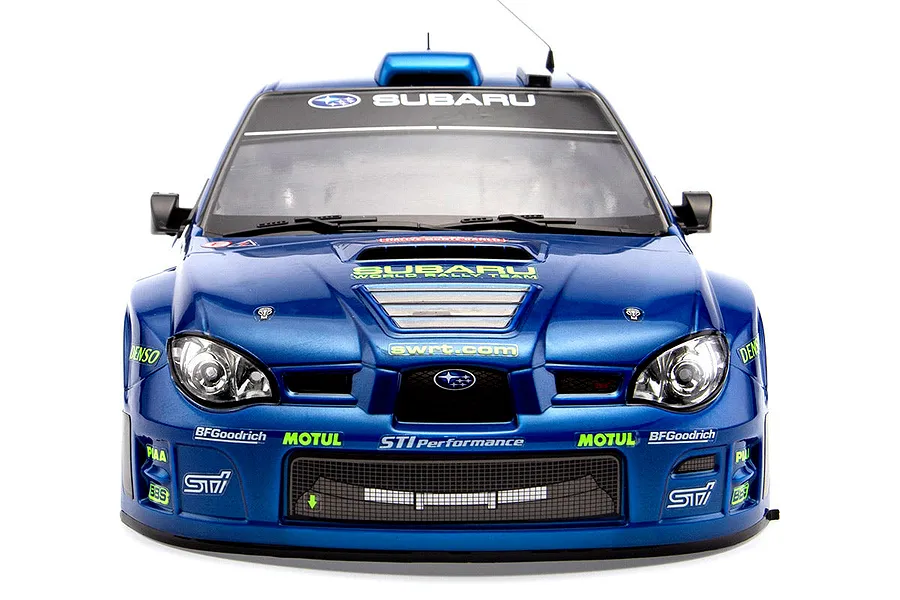 Front view of a 1/10 scale Killerbody 2007 Subaru Impreza WRC painted RC car body shell in metallic blue with sponsor decals.