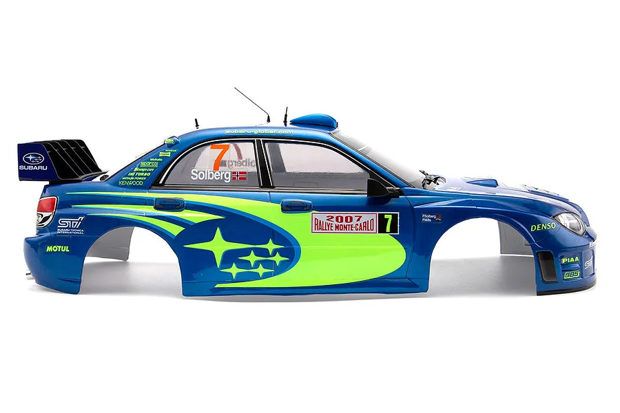 Side view of a 1/10 scale painted RC body shell of a 2007 Subaru Impreza WRC rally car in blue with yellow accents and racing decals.