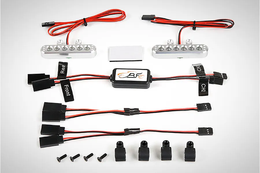 Rovan 5IVE-T RC light controller kit including two LED light bars, a central control module, wiring harnesses, mounting clips, and screws.