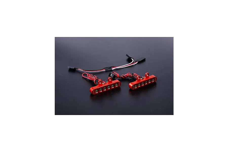 Two orange anodized aluminium LED tail light bars for an RC vehicle, each with five small LEDs and wiring harnesses.