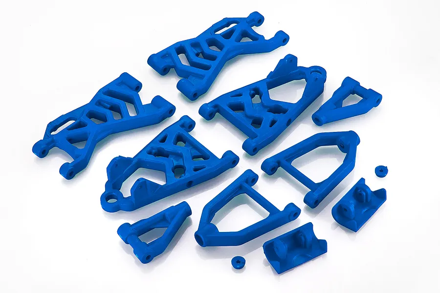 A set of blue plastic RC Baja suspension arms and associated mounting components arranged on a white background.