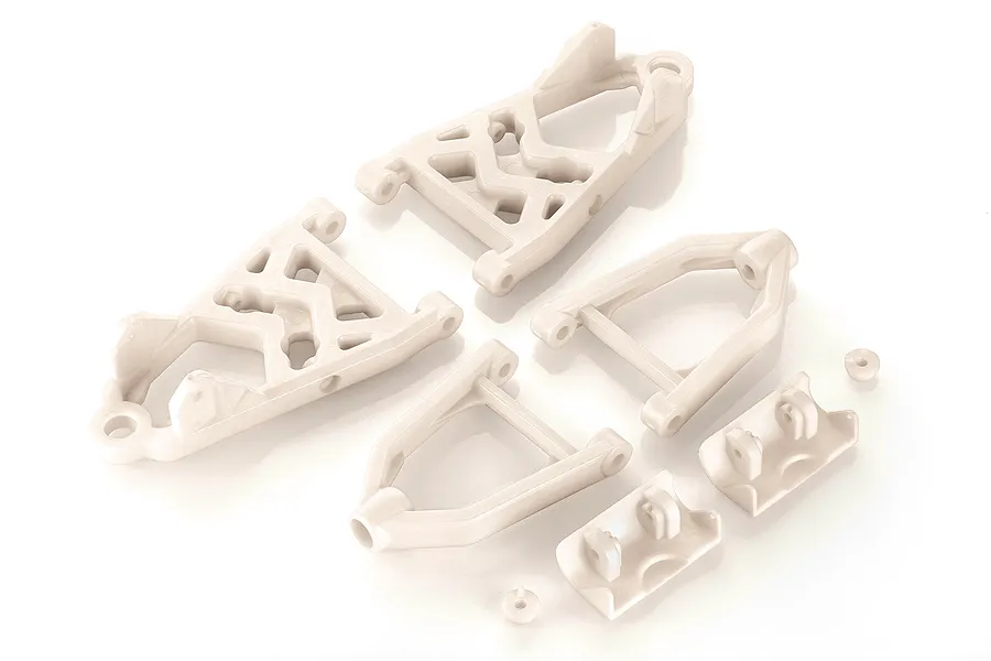 A set of white plastic front suspension arms and mounting components for an RC vehicle, arranged on a white background.