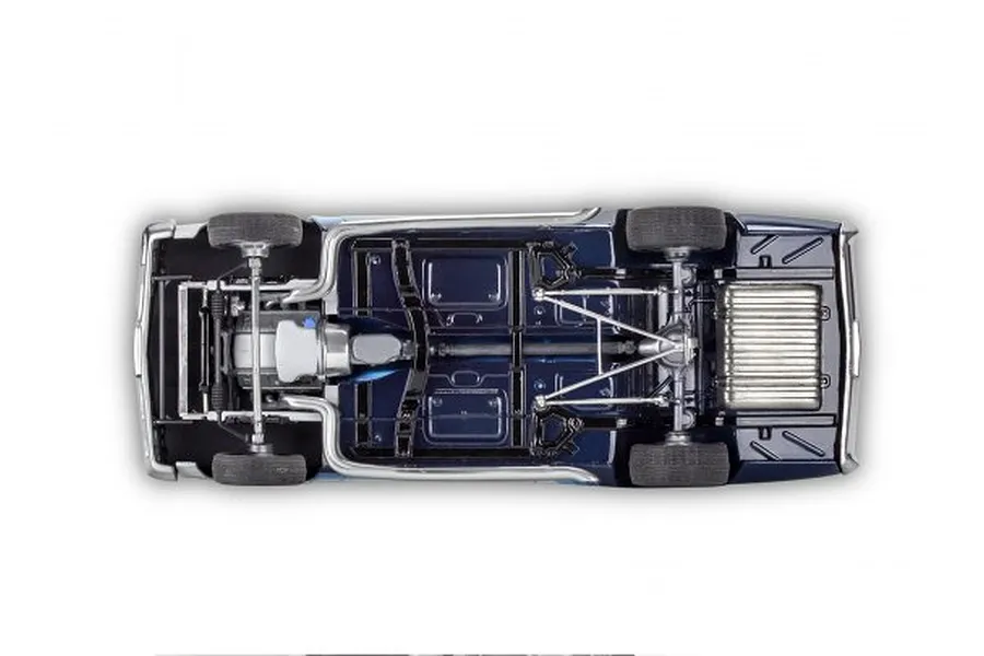 Bottom view of a 1/24 scale Revell 1966 Malibu SS model car showing the chassis, drivetrain, exhaust, and suspension details.