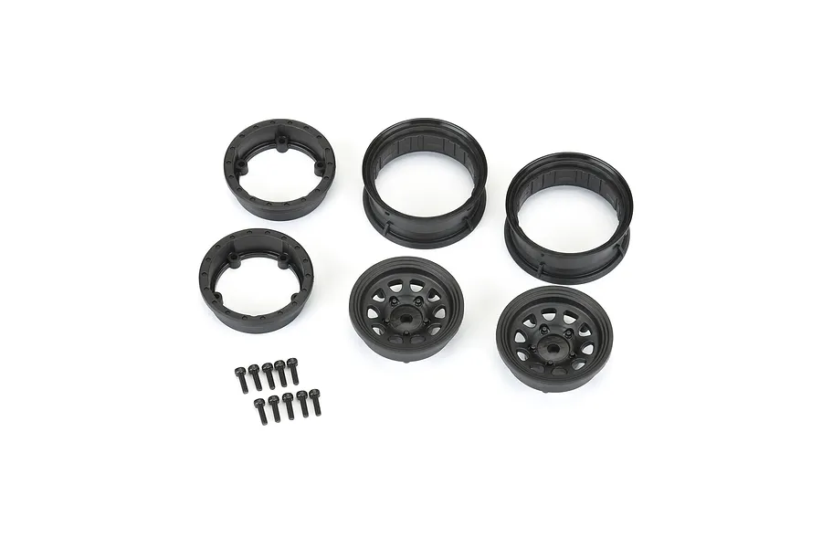 Pro-Line 1.55 inch black Keystone beadlock rim components including wheel faces, barrels, and mounting screws on a white background.