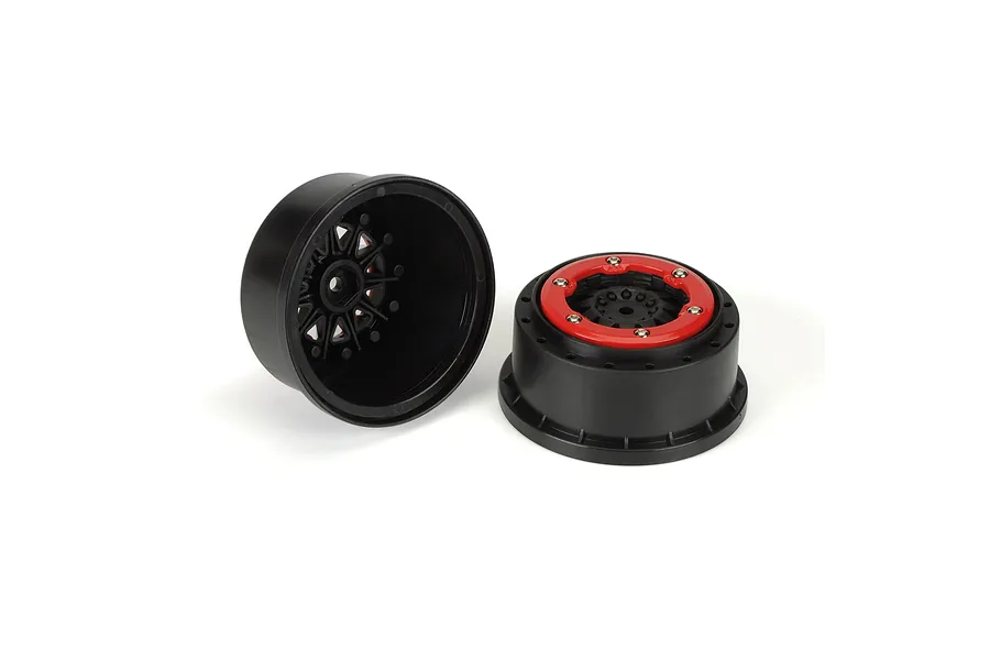 Two Pro-Line F-11 short course RC wheels with black rims and red beadlock rings on a white background.