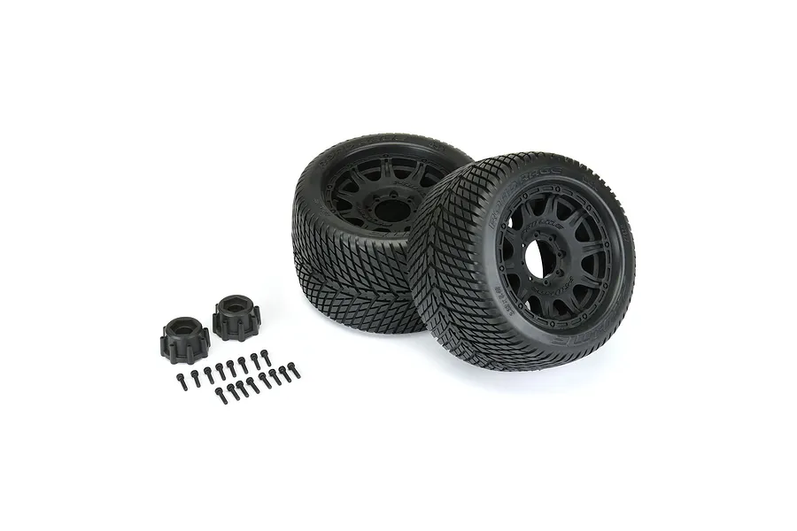 Two Pro-Line 3.8 inch Road Rage RC monster truck tyres pre-mounted on black Raid wheels, including two hex adapters and a set of mounting screws.