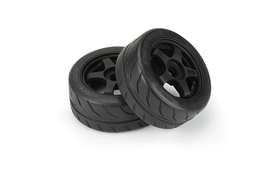 Two Pro-Line 2.9 inch Toyo Proxes R888R belted RC car tires mounted on black five-spoke rims, isolated on a white background.