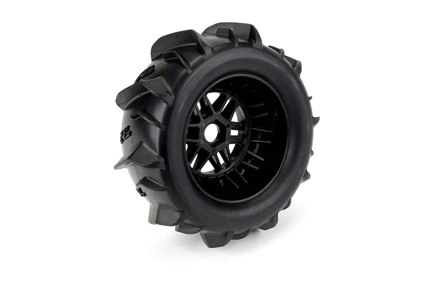 Pro-Line Dumont paddle tyre mounted on a black split-six RC wheel, viewed from a three-quarter angle against a white background.