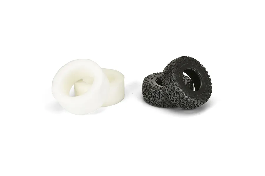 Two black Pro-Line BFGoodrich KO2 RC short course tyres and two white foam tyre inserts on a white background.