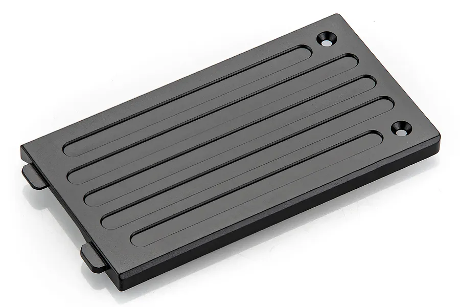 A black anodized aluminium centre chassis skid plate for an RC car, featuring recessed grooves and two countersunk mounting holes.