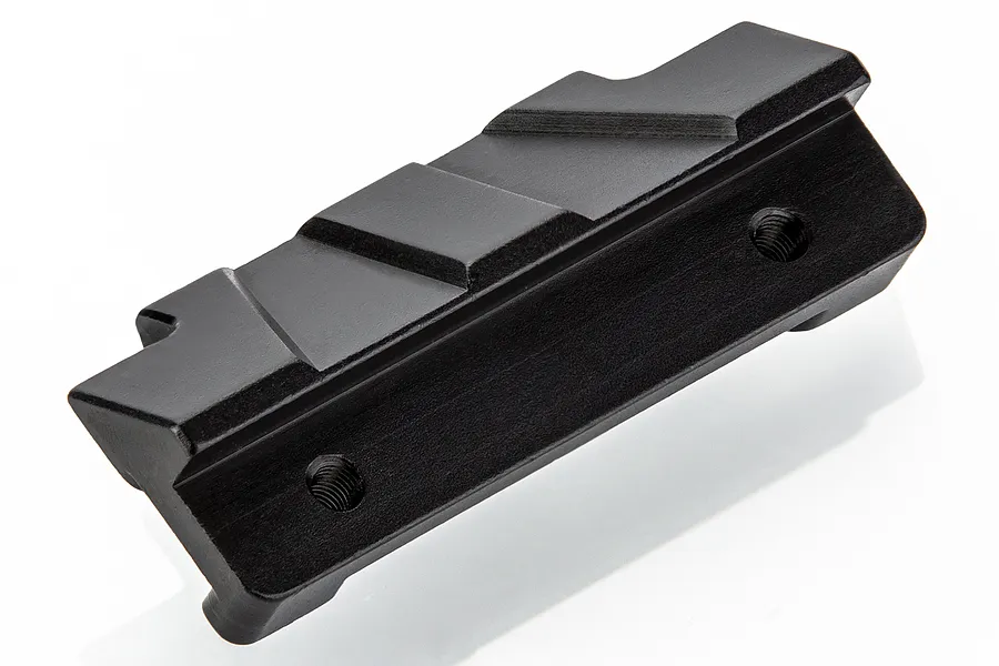 A black anodized aluminium front bumper mount for an RC car, featuring a machined design with two threaded screw holes.