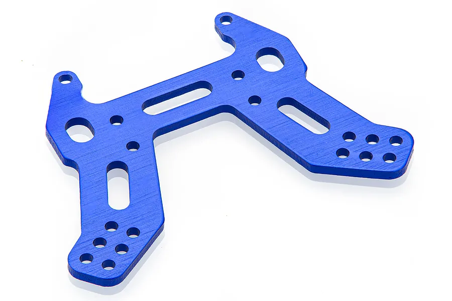 A dark blue anodized aluminium front shock tower for an RC car, featuring multiple mounting holes and cutouts against a white background.