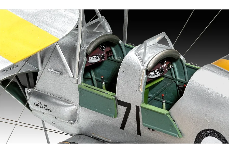 Close-up view of the cockpit area of a 1/32 scale Revell D.H. 82A Tiger Moth model aircraft, showing detailed instrument panels and silver fuselage.