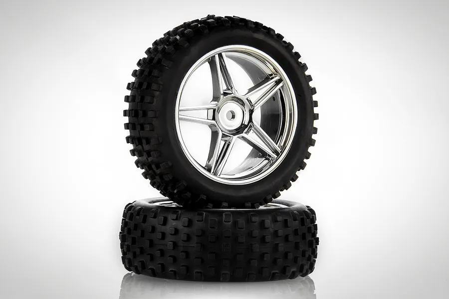 Two HSP 1/10 scale RC buggy front wheels with black knobby rubber tyres and five-spoke silver chrome rims stacked on a white background.