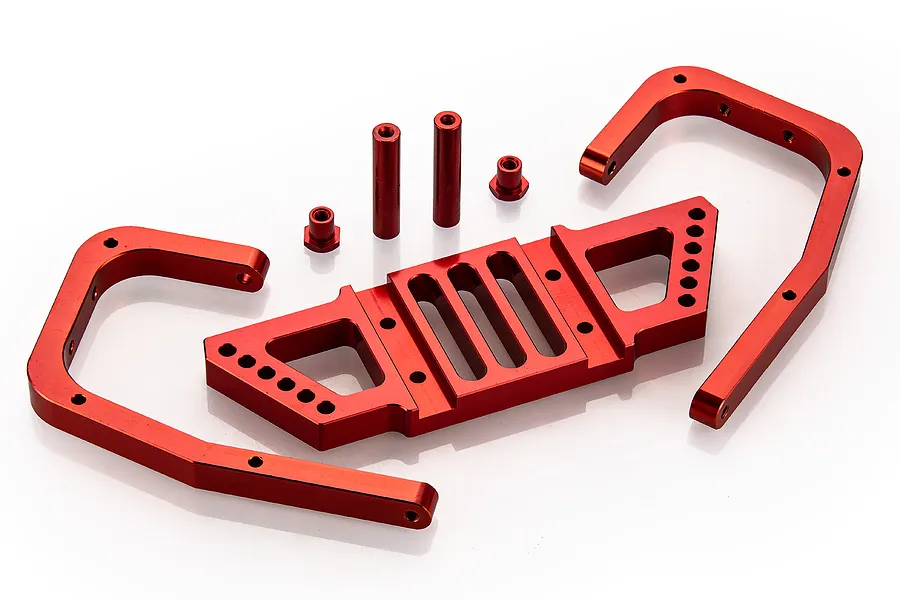 A Rovan red anodized aluminium rear bumper kit for an RC car, including a main bumper plate, two side support arms, two standoffs, and two small spacers.