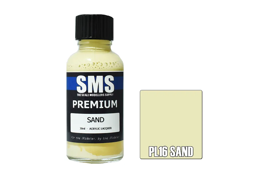 A 30ml bottle of Scale Modellers Supply Premium Sand acrylic lacquer paint with a black cap and a color swatch showing the sand color.