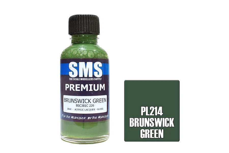 A 30ml bottle of Scale Modellers Supply Premium Brunswick Green acrylic lacquer paint with a black cap, next to a dark green color swatch labeled PL214.