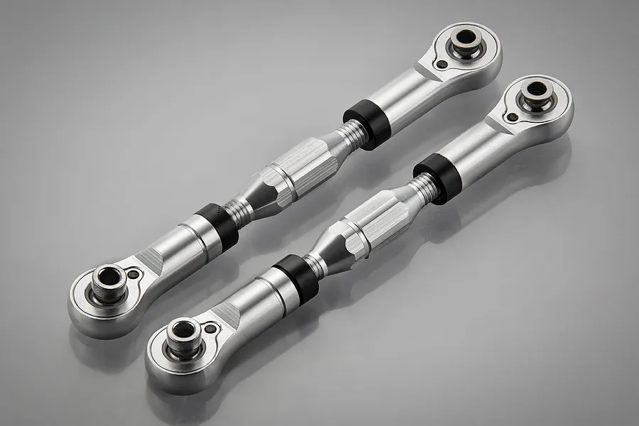 Two silver aluminium RC suspension tie rods with adjustable turnbuckle centers and ball joint ends on a grey background.
