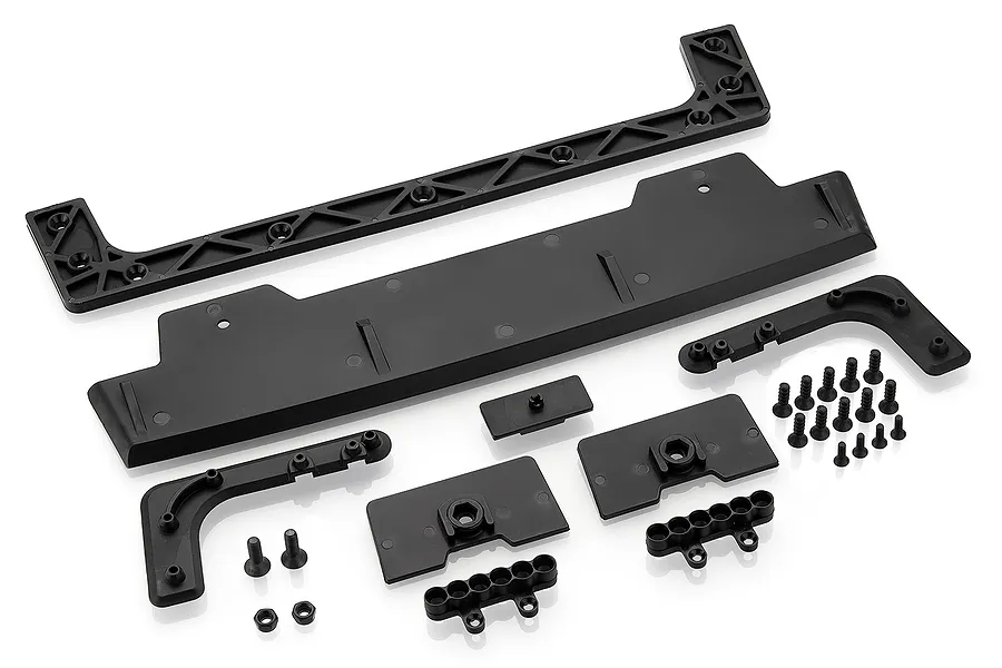 A Rovan black rear wing set for an RC Baja 5T, including the main wing, support brackets, mounting plates, and a collection of screws and nuts.