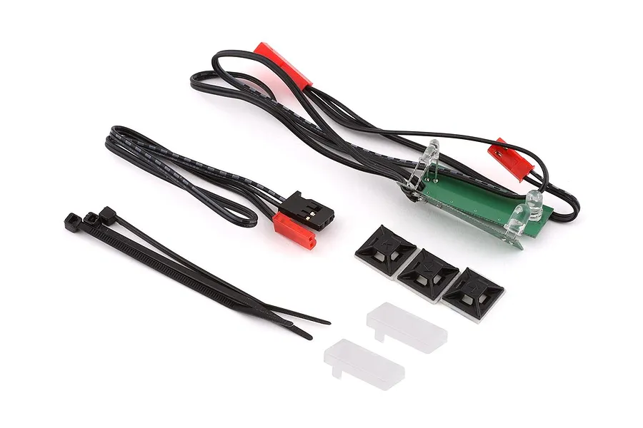 Traxxas front LED light set including wiring harness, circuit board, zip ties, and mounting hardware on a white background.