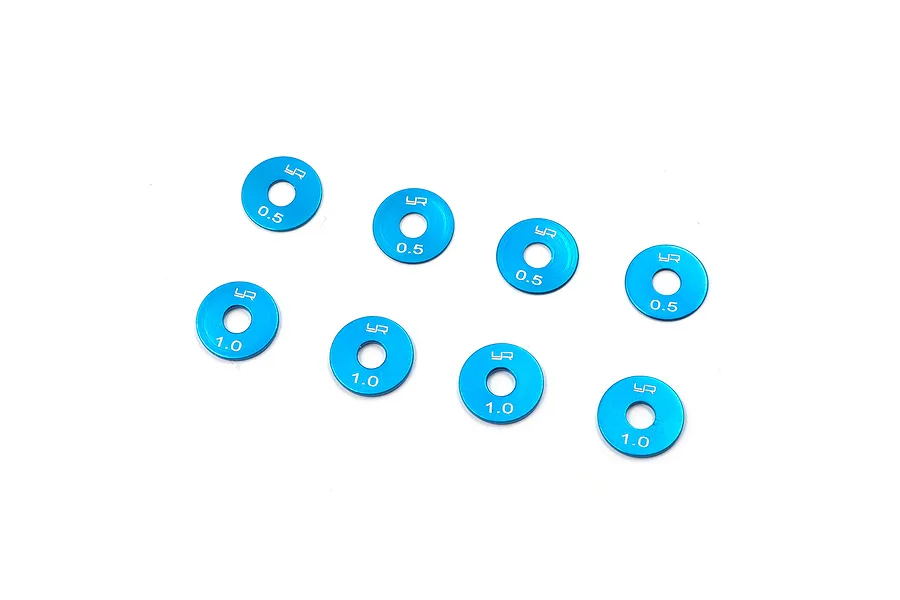 Eight blue anodized aluminium wheel shims from Yeah Racing, showing four 0.5mm and four 1.0mm sizes on a white background.