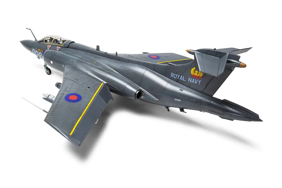 A high-angle studio shot of a fully assembled and painted 1/48 scale Airfix Blackburn Buccaneer model aircraft, viewed from the rear three-quarter angle.