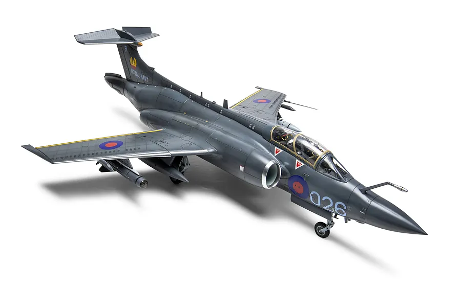 A fully assembled and painted 1/48 scale plastic model of a Blackburn Buccaneer S.2C/D aircraft in Royal Navy markings, viewed from a high-angle perspective.
