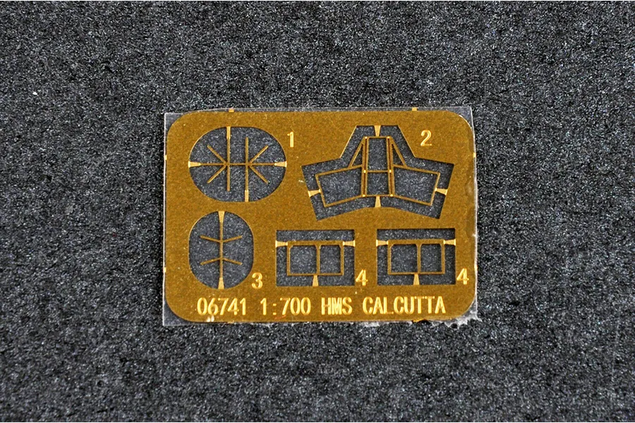 A small brass photo-etched detail sheet for a 1/700 scale HMS Calcutta model kit, featuring various small parts numbered 1 through 4.
