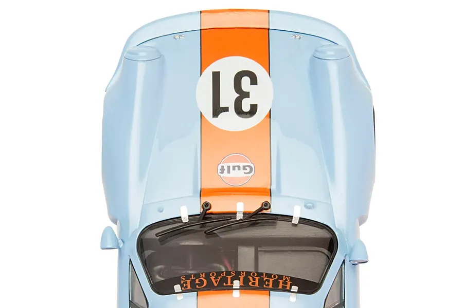 Top-down view of a light blue and orange Gulf livery Scalextric Porsche 911 Carrera RSR 3.0 slot car with the number 31 on the hood.
