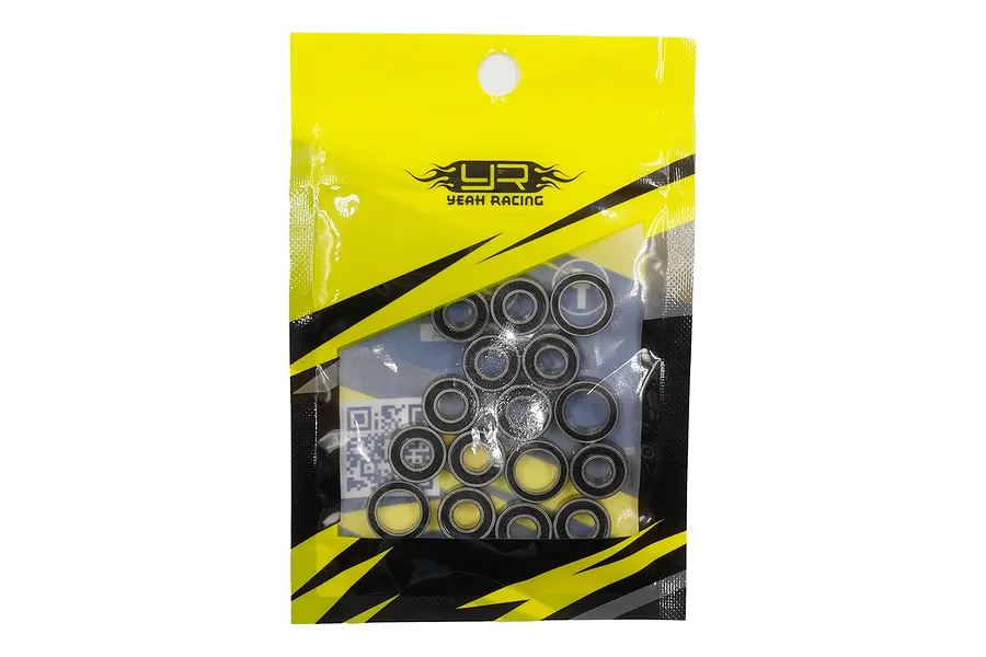 A sealed yellow and black Yeah Racing branded plastic bag containing a set of rubber shielded ball bearings for an RC car.