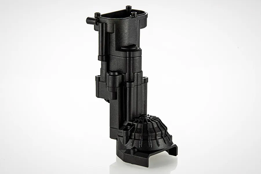 A black plastic RGT gearbox case component for an RC vehicle, shown against a white background.
