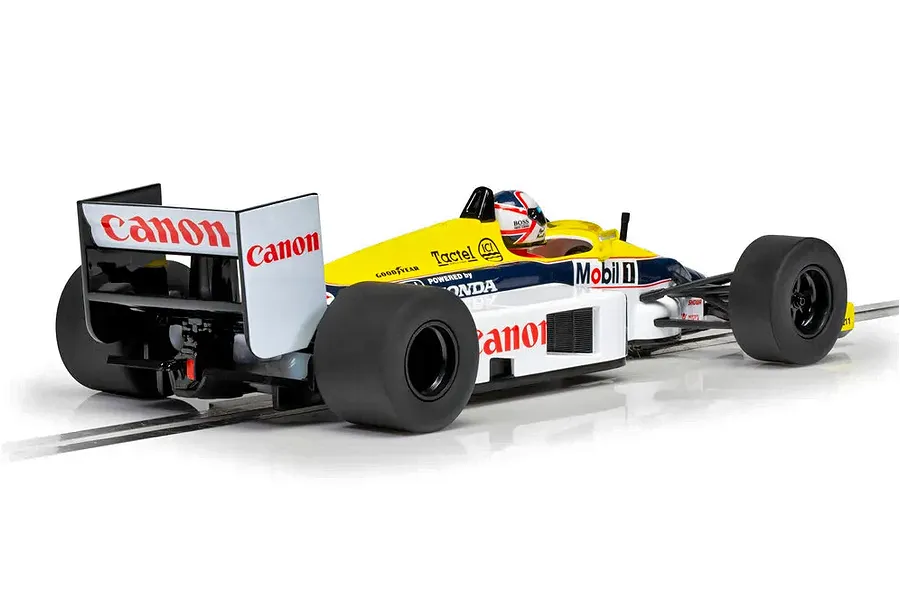A 1/32 scale Scalextric Williams FW11 slot car in white, yellow, and blue livery with Canon branding, viewed from the rear three-quarter angle.