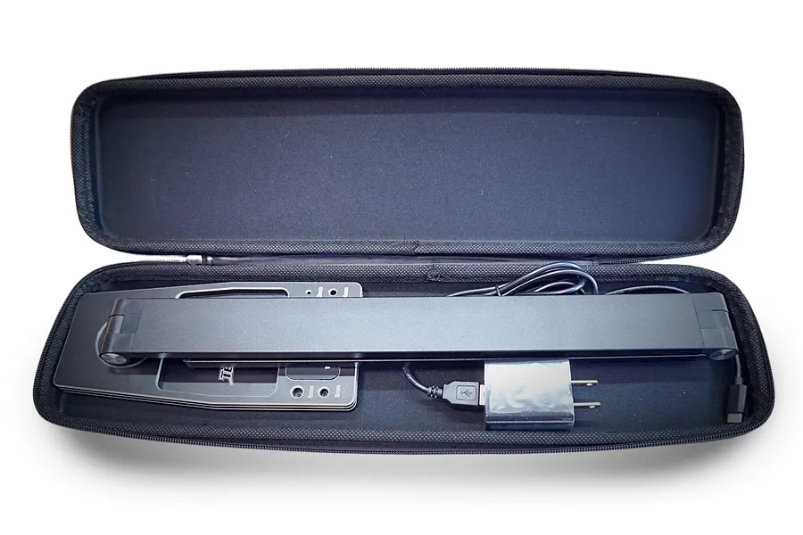 Team Powers LED Pit Light Pro folded inside its black zippered protective carrying case with a USB power adapter and cable.