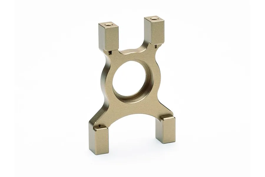 A gold-anodized aluminium centre differential mount for an RC car, featuring a central circular opening and four mounting points.