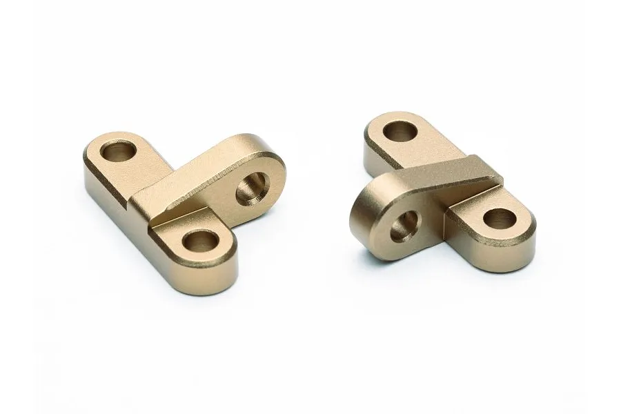 Two gold-anodized aluminium RC chassis brace components shown from a high angle against a white background.