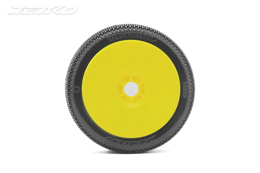 A single Jetko 1/8 scale Red Devil buggy tyre mounted on a yellow dish rim, viewed from the side against a white background.