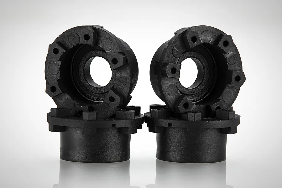 Two black plastic 17mm wheel connectors for RC cars, shown from a side and front angle against a white background.