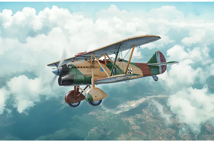 Box art illustration of a Fiat CR.32 biplane fighter flying through clouds above a landscape.