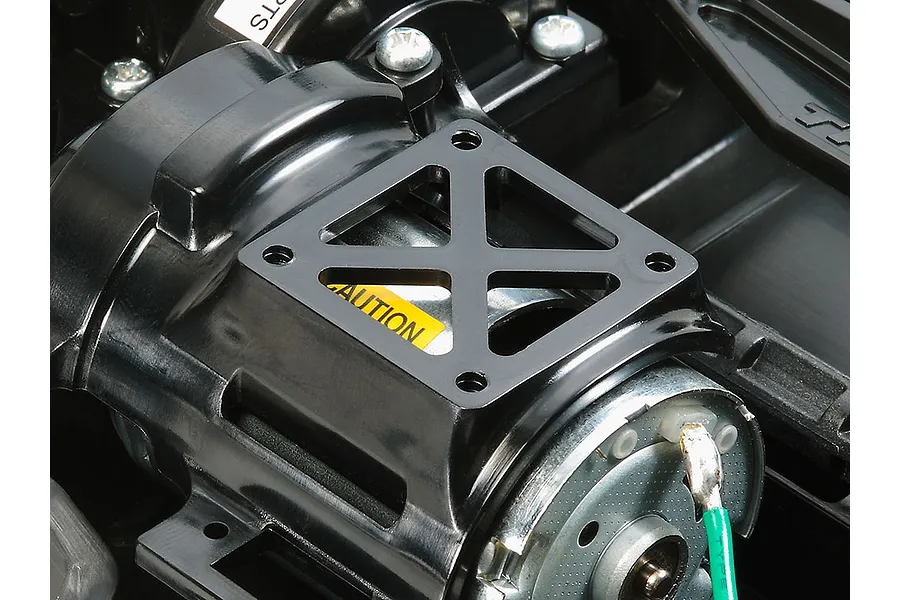 Close-up of the motor mount and electric motor installed in a Tamiya TT-02 RC chassis.